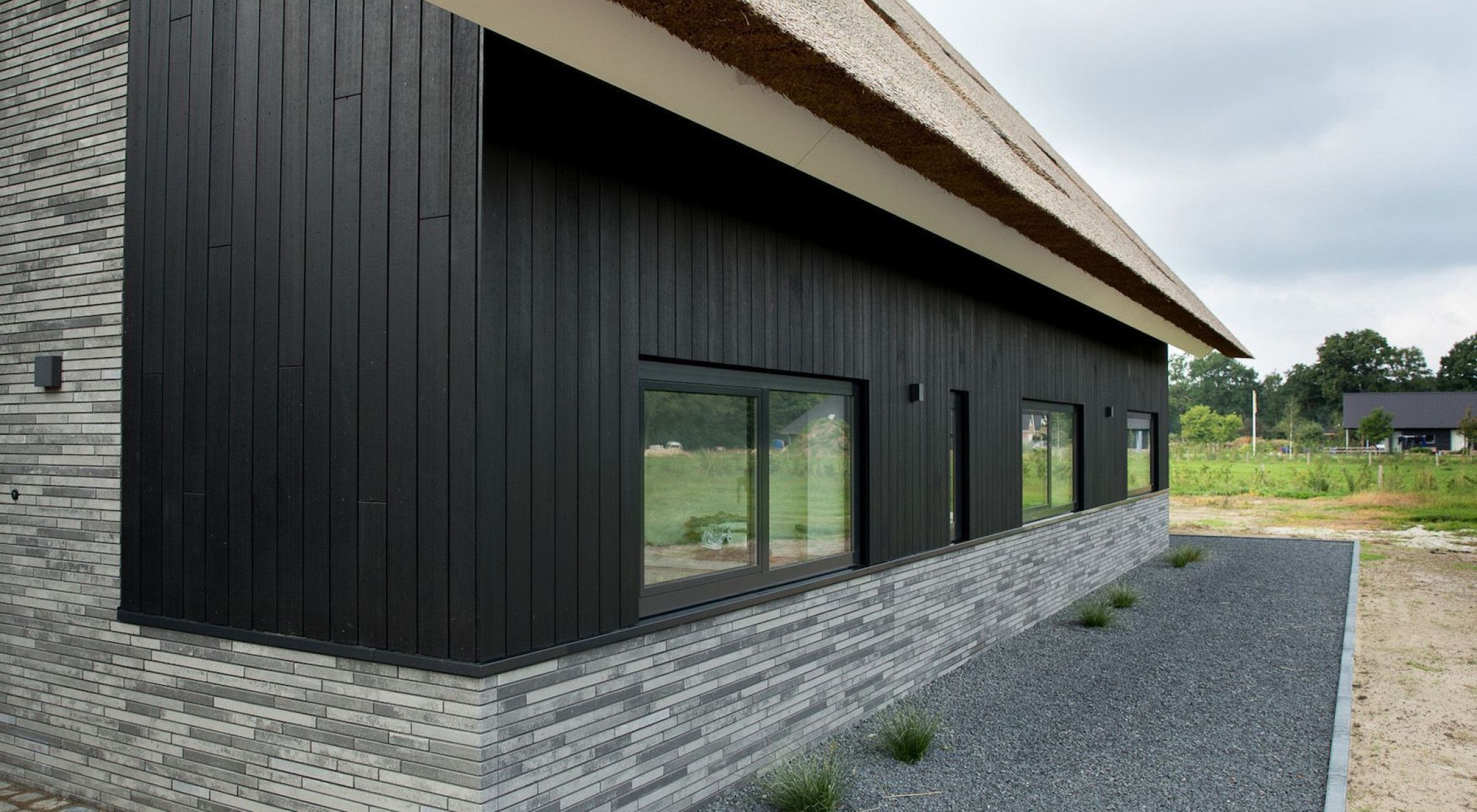 Schuurwoning met naturalcladding gevelbekleding